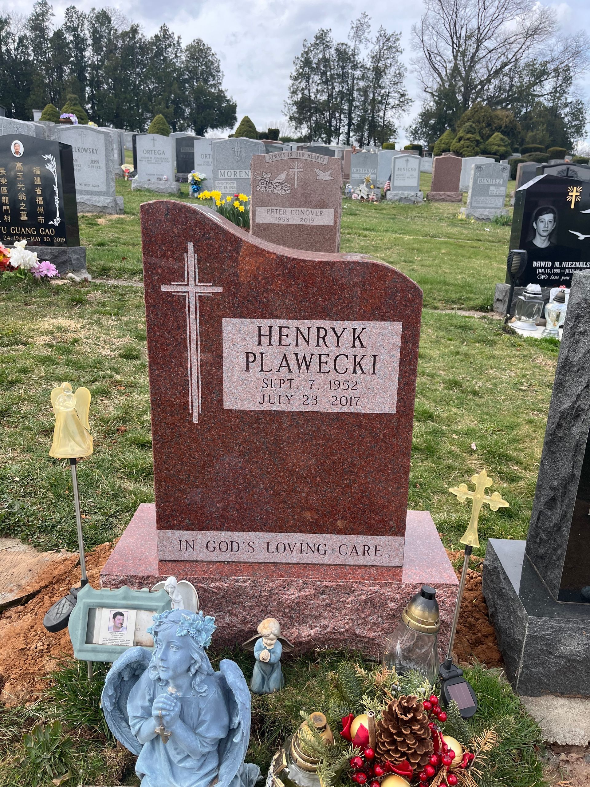 Plawecki Upright India Red With a Swooping Top. Polished stone on all sides with a cross on the top left side. Contemporary Cross Design