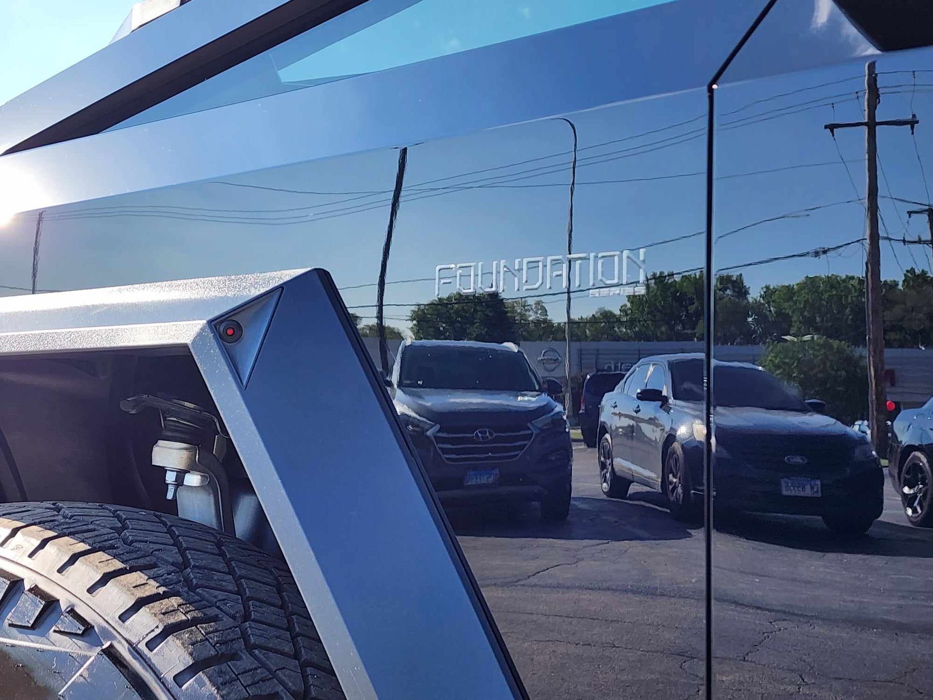 A car is parked in front of a building that says foundation.