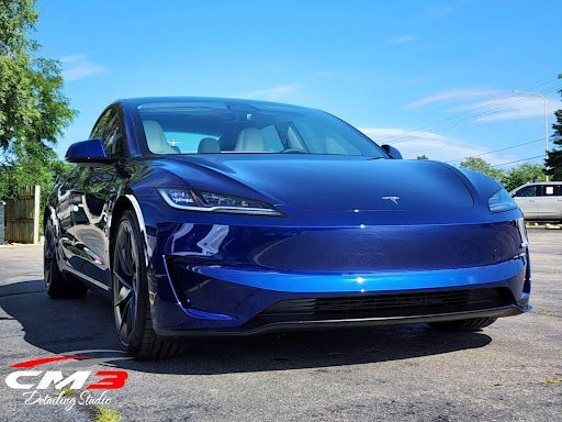 Blue Tesla with full front clear bra protection at CM3 Detailing Studio