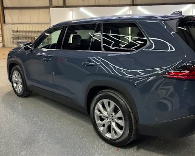 Dark SUV during window tint installation at CM3 Detailing Studio & Ceramic Coating in Elgin, IL