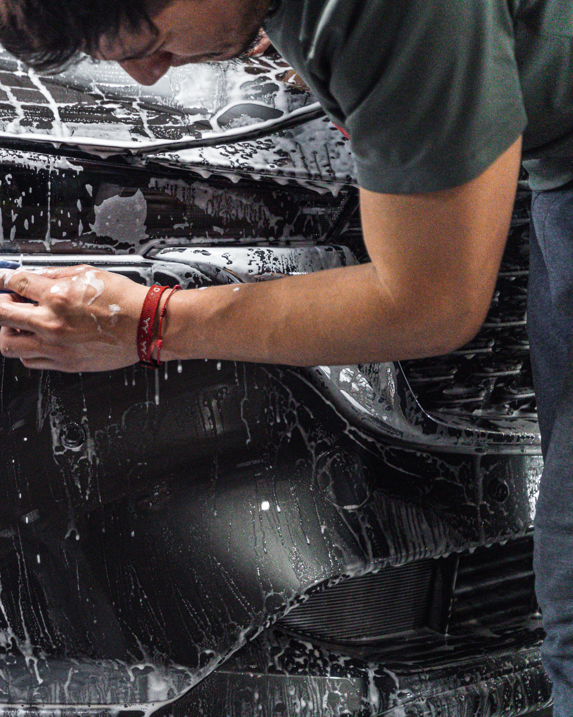 White Lexus sedan parked outside, sunny day.