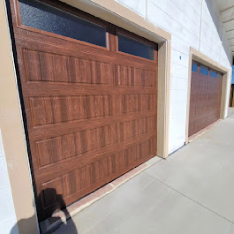 A row of wooden garage doors on a white building