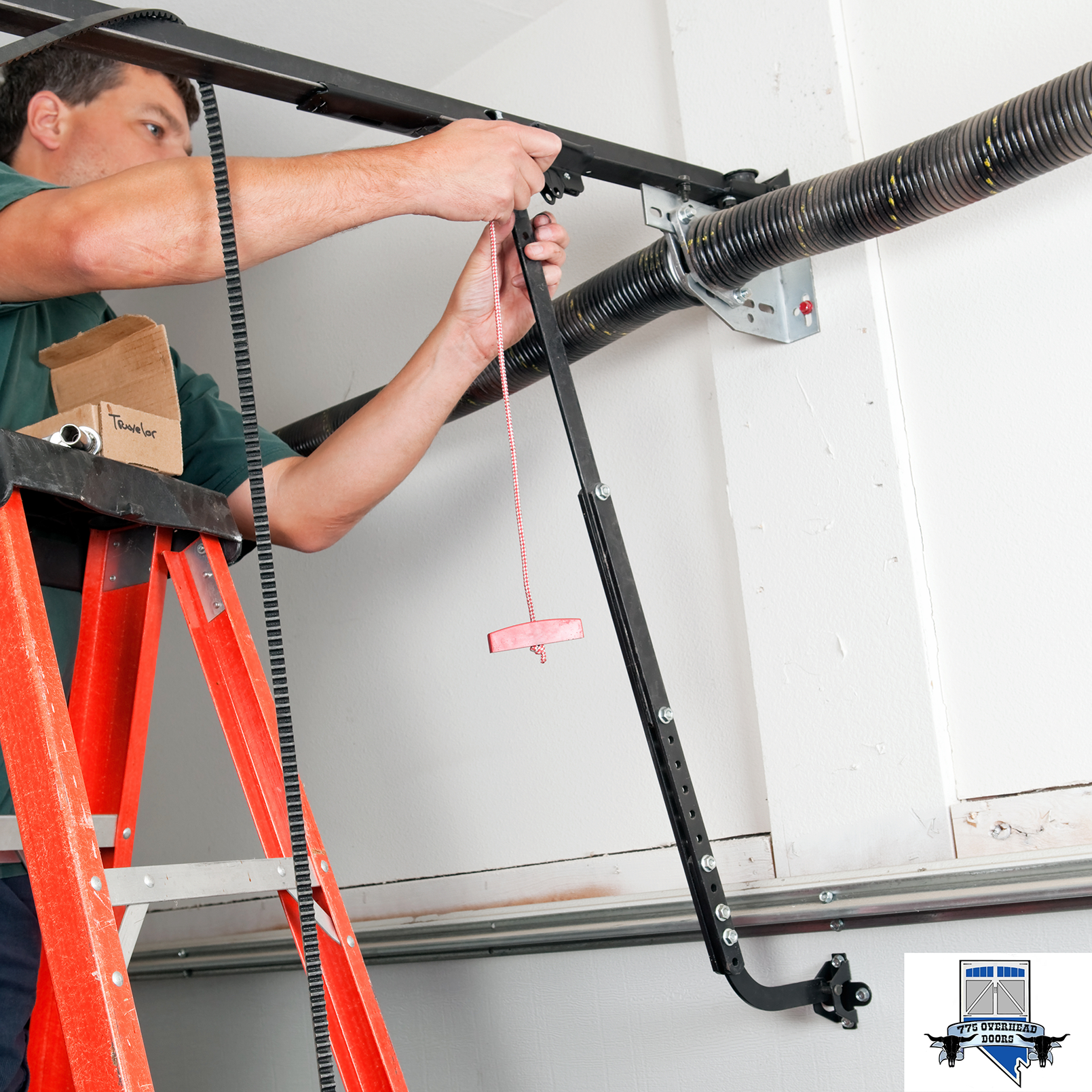 A man on a ladder working on a garage door