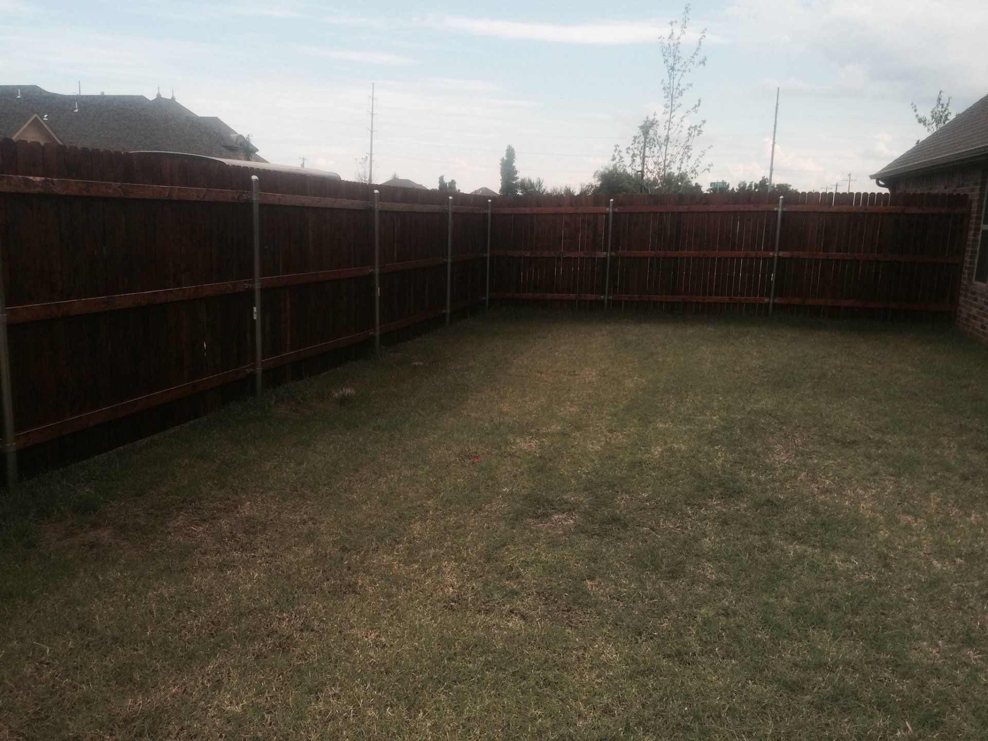 Oxford  Brown Excellent Fence — Brown Colored Fence on Barn in Oklahoma City, OK
