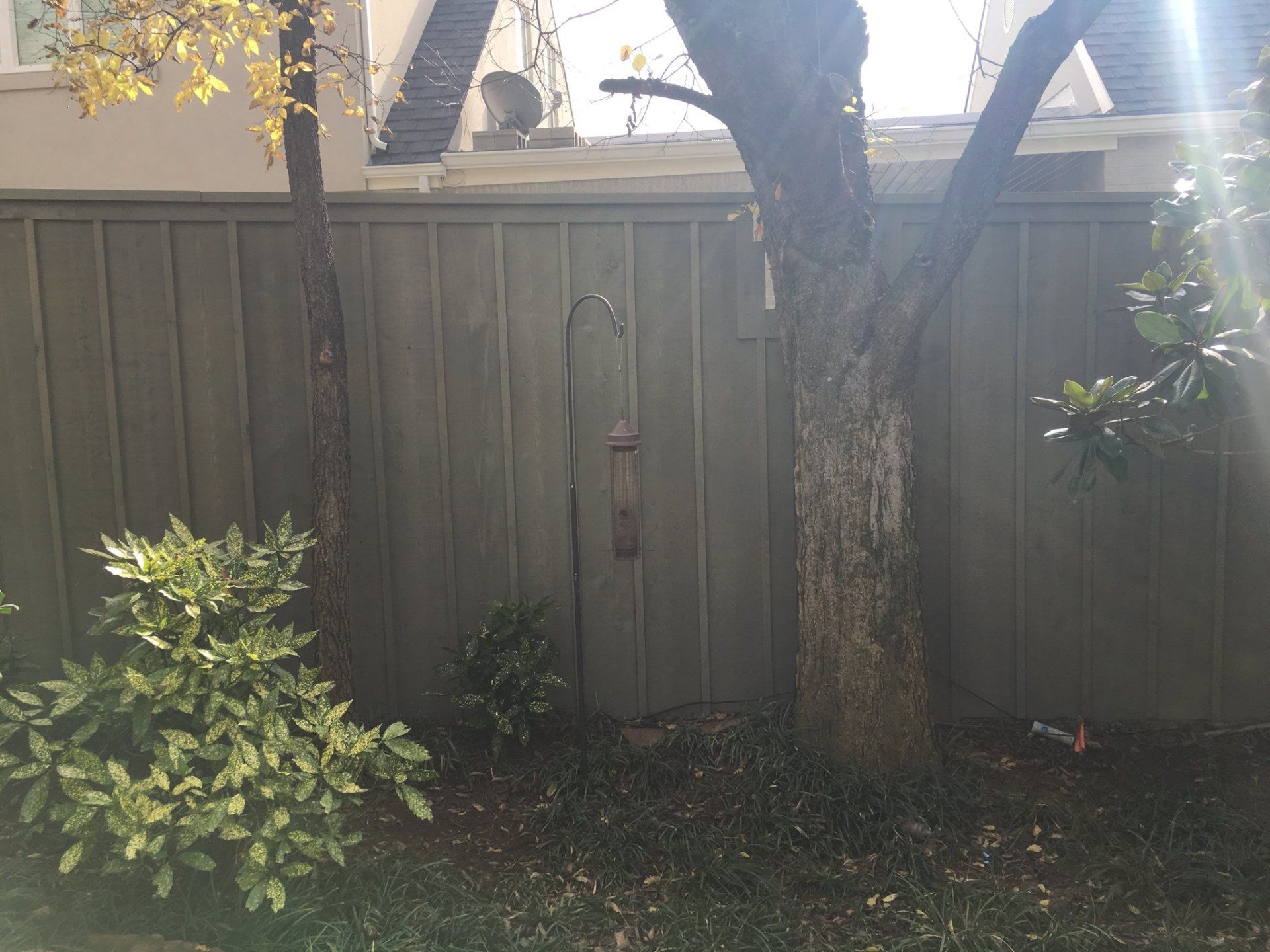 Greystone Door Fence — Grey Colored Fence on Garden in Oklahoma City, OK