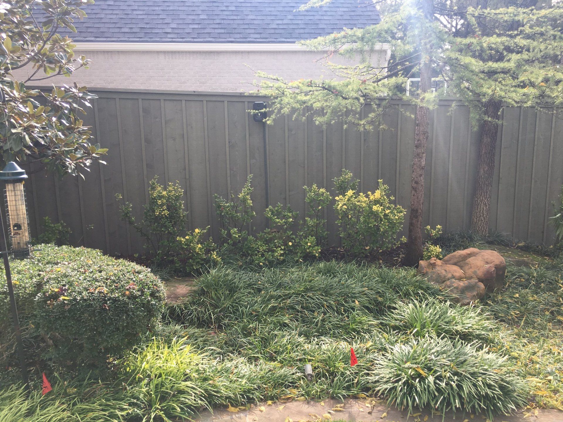 Quality Greystone Fence — Grey Colored Fence on Garden in Oklahoma City, OK