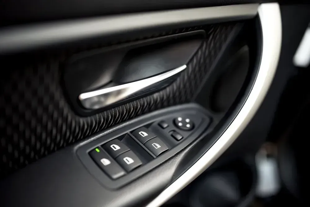 Black Car Door Panel with Window and Lock Controls — Hervey Bay Mobile Windscreens in Pialba, QLD