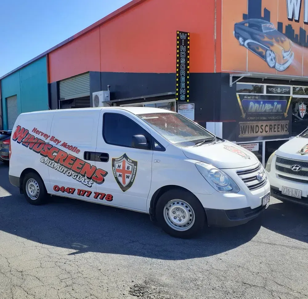 White Van with Logo Parked in Front of A Building — Hervey Bay Mobile Windscreens in Pialba, QLD