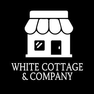 White storefront icon with awning; “White Cottage & Company” text below.