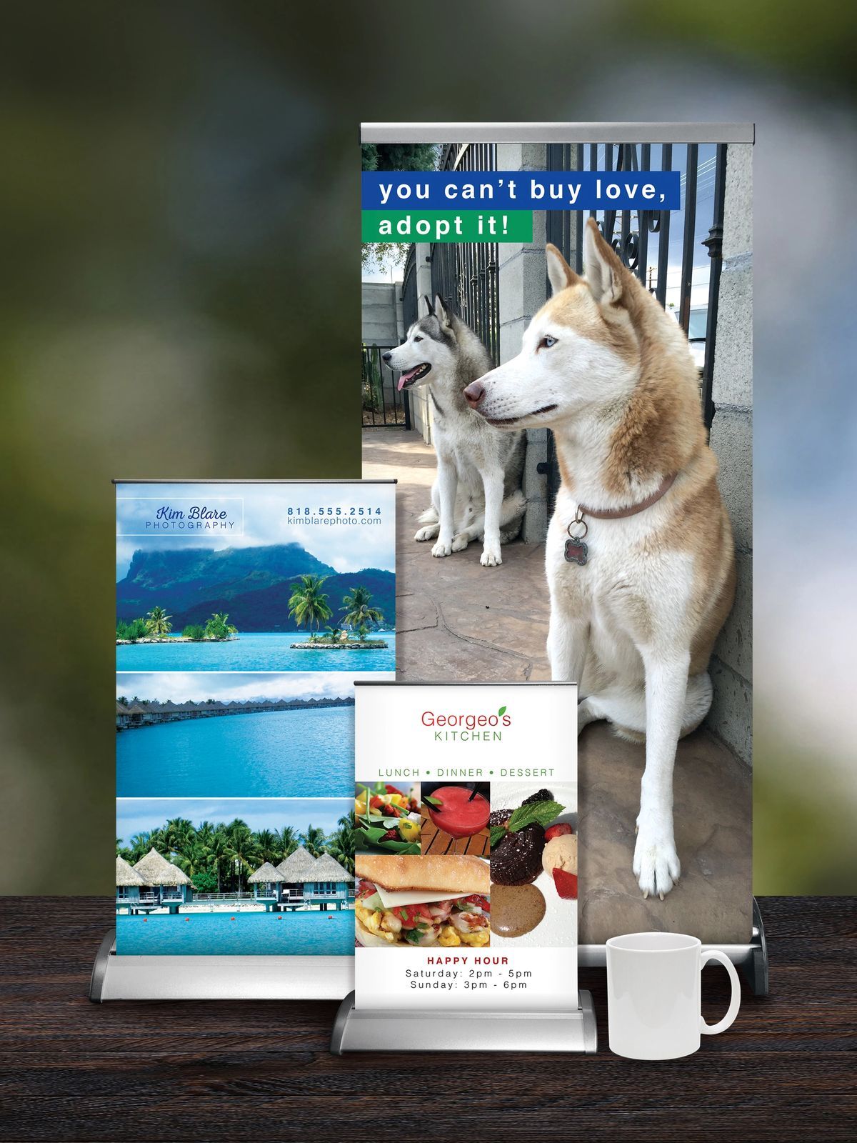 Dog adoption banner next to smaller travel and food ads, a mug on wooden surface.