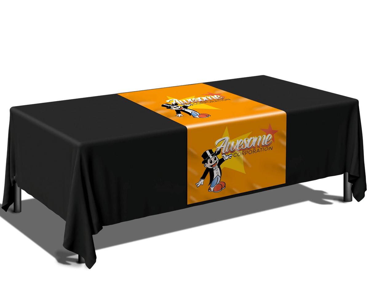 Black table covered with a matching cloth, orange table runner featuring a skater graphic and the word 