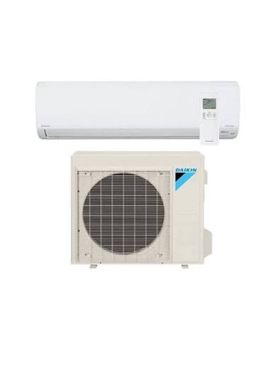 White Daikin air conditioner split system: indoor unit above, outdoor unit below.