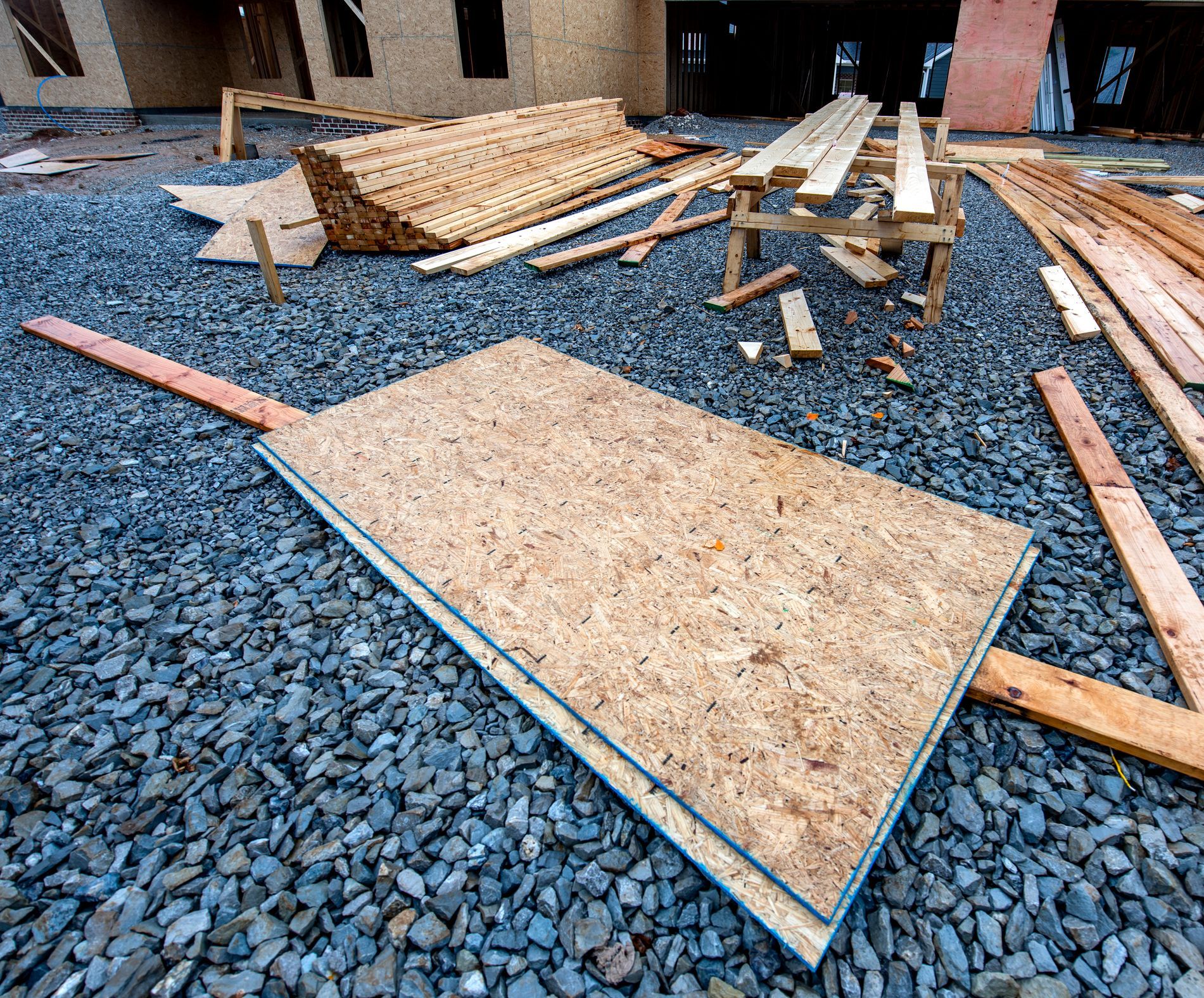 A Pile of Wood Is Laying on the Ground at a Construction Site — Rogers, MN — Supplement Negotiators LLC