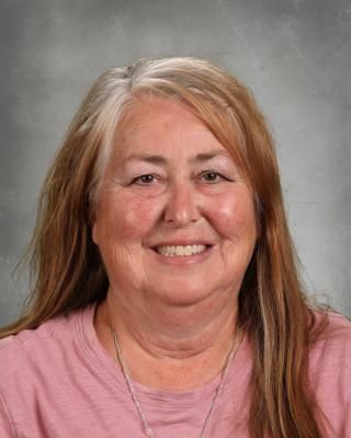 A black and white silhouette of a paw print on a white background.
