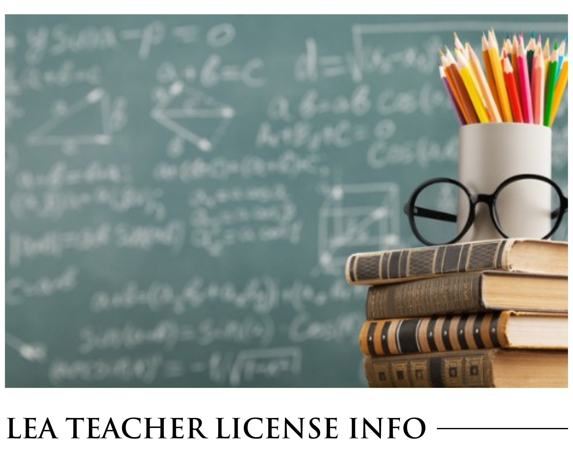 A stack of books with glasses and pencils in front of a blackboard