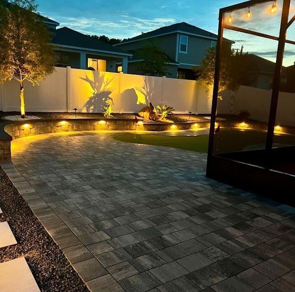 The backyard of a house is lit up at night