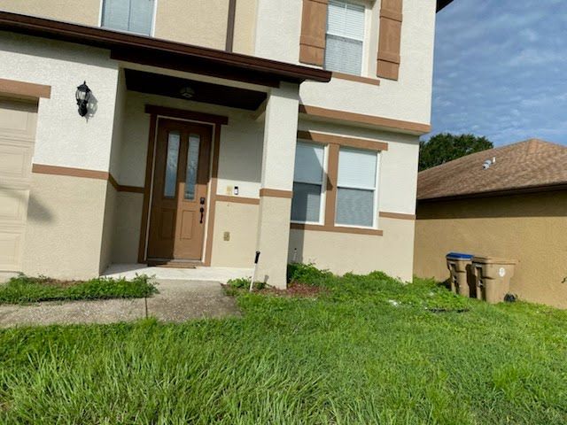 A house with a lot of grass in front of it