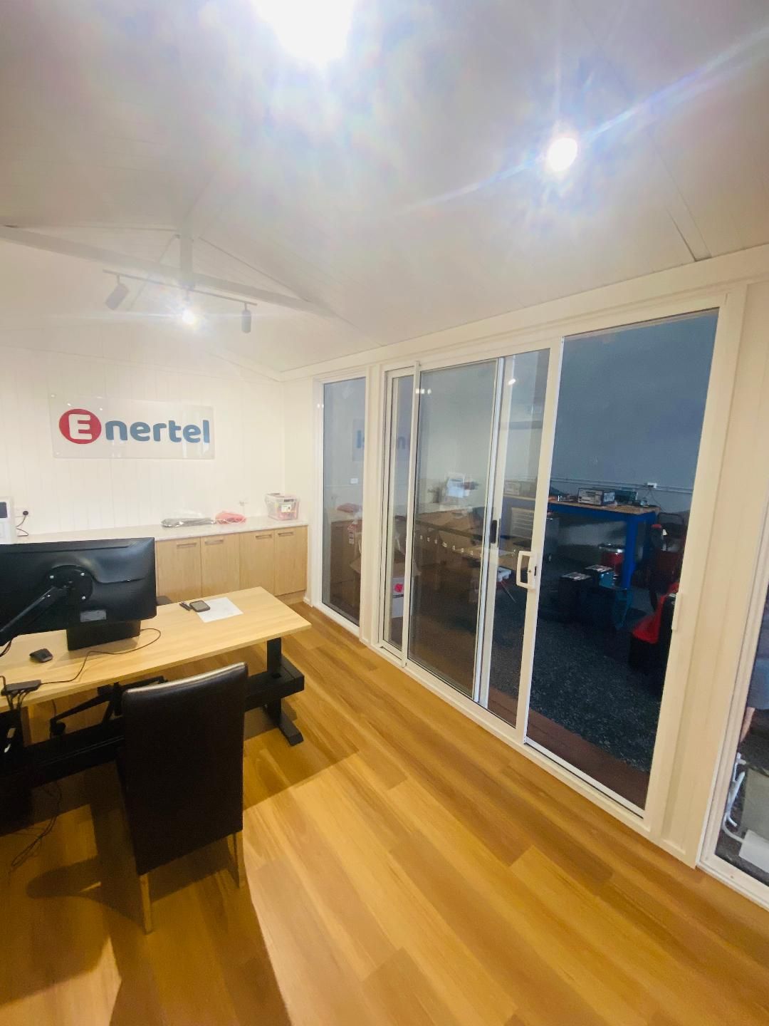 Office interior with desk, sliding doors, 