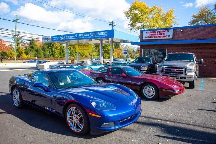 Various Cars Outside of Shop