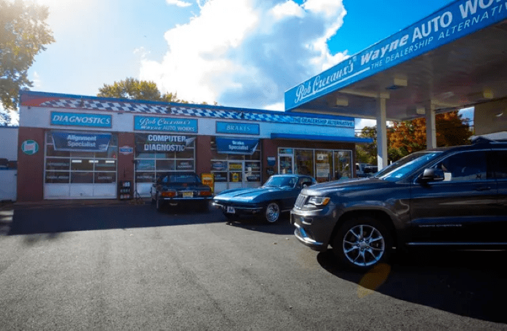 Exterior of Shop with Vehicles