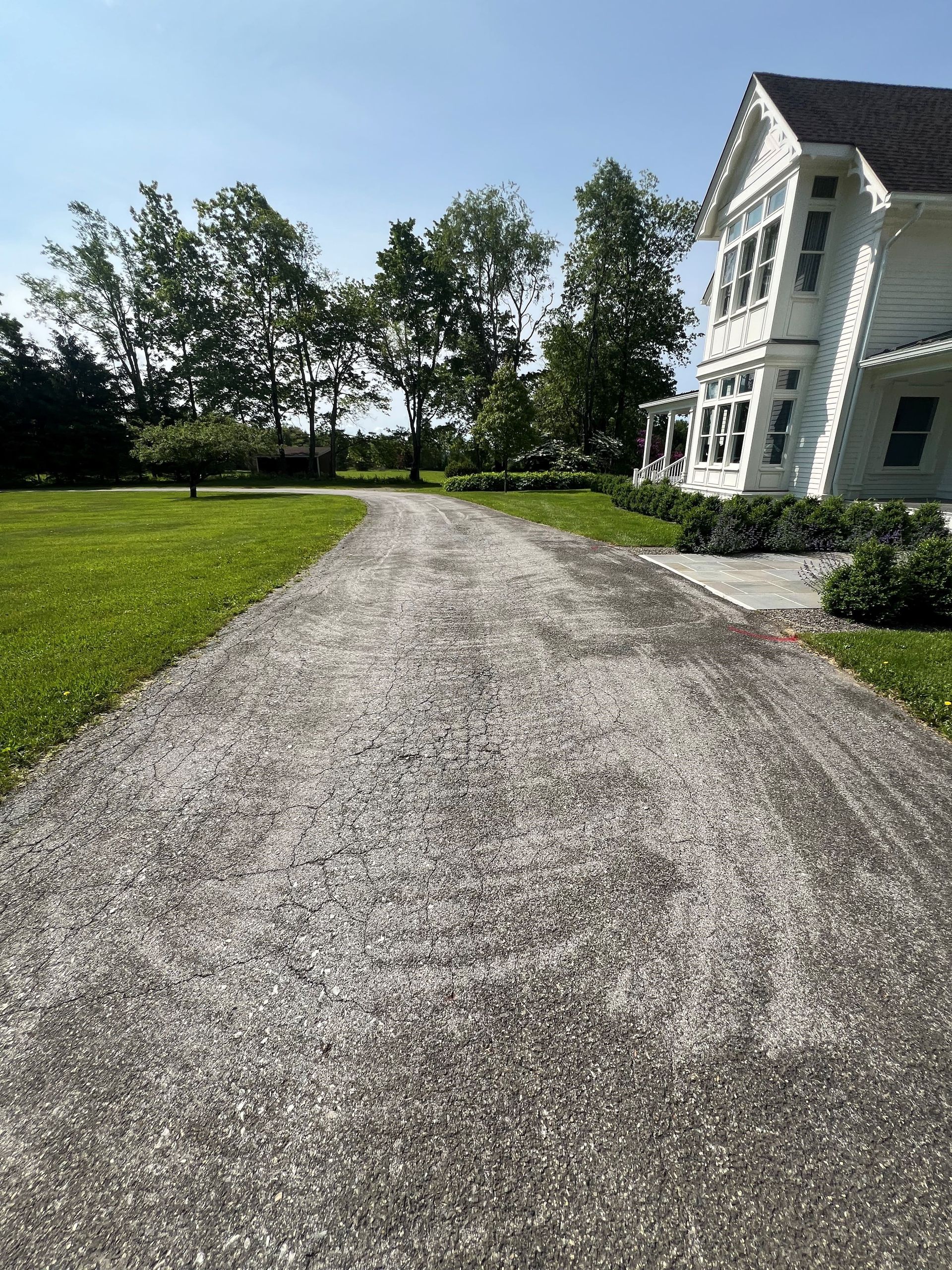 Before blacktop oil-and-chip resurfacing by B&E Paving & Sealcoating in Stormville, NY