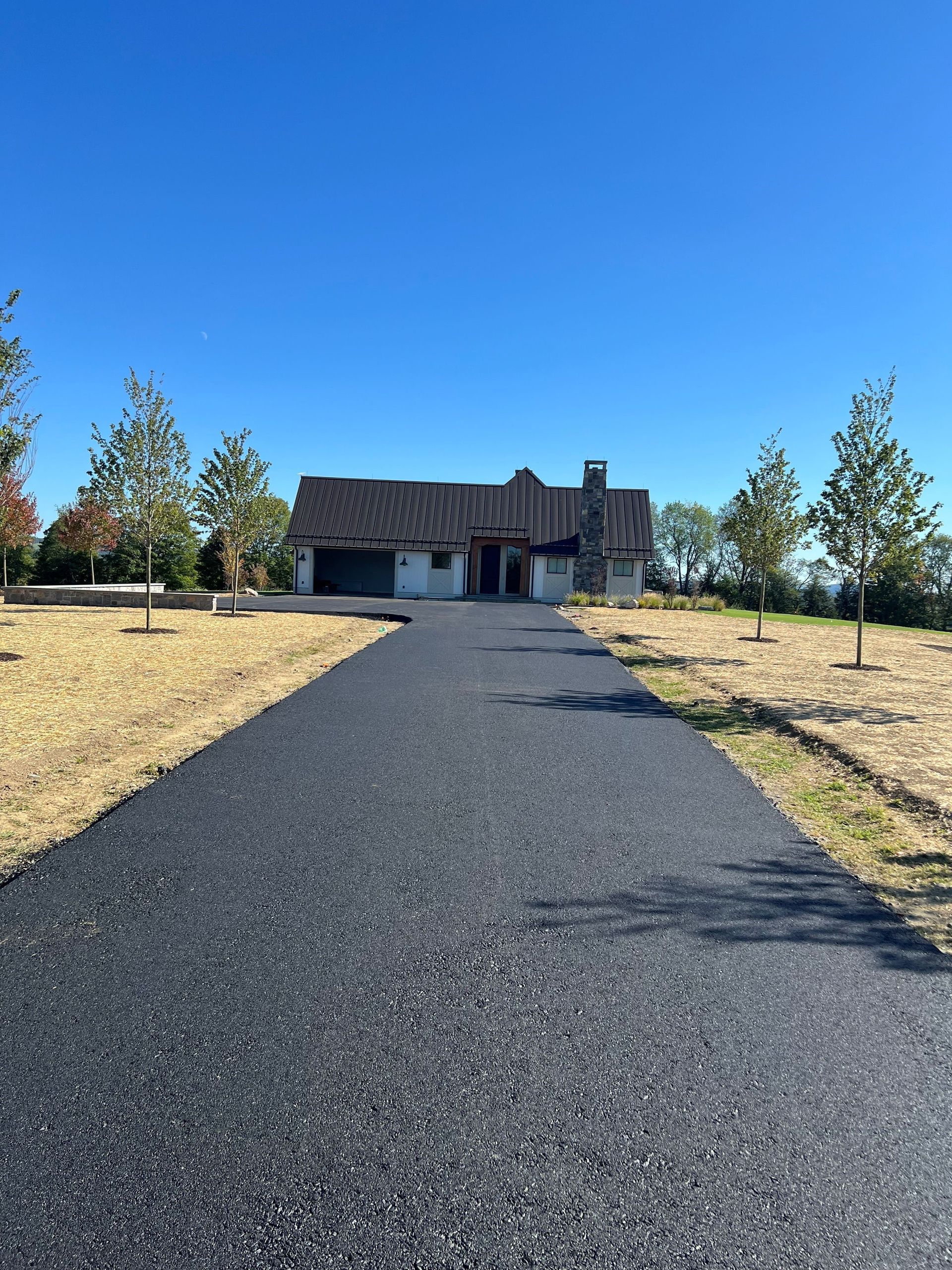 Fresh asphalt paving with clean, smooth finish