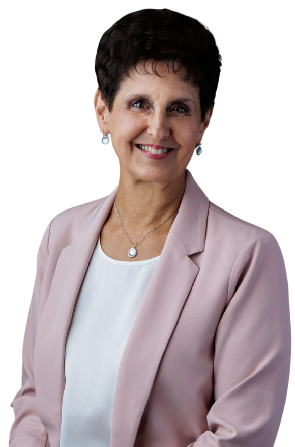 Woman with short dark hair, wearing a pink blazer and smiling.