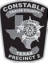 Badge for Constable Precinct 2, Travis County, Texas, featuring the Texas outline and sheriff's badge.