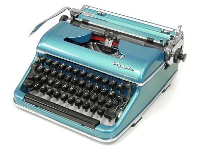 Blue vintage typewriter on a white surface, keys and carriage visible.