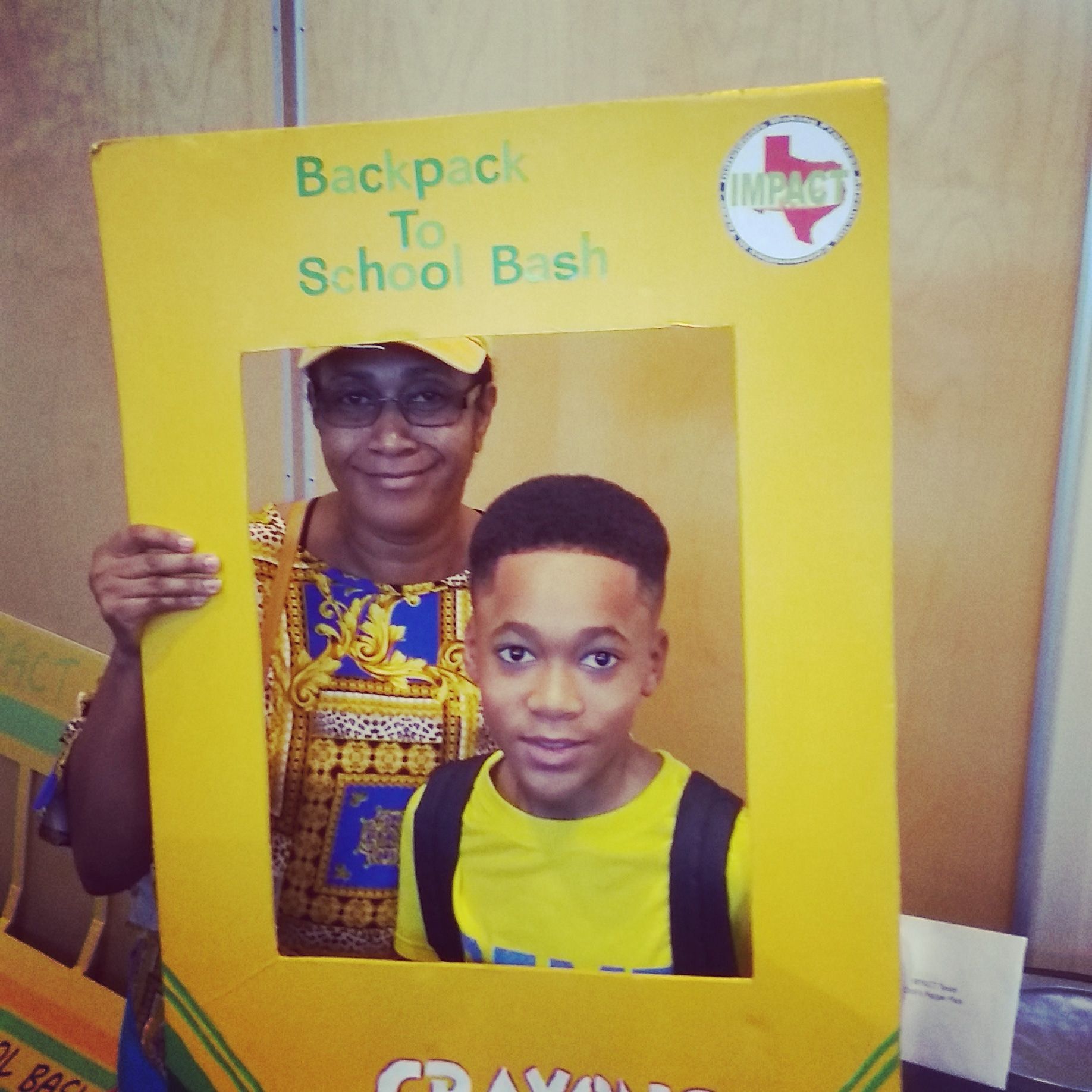 Woman and child posing inside a yellow 