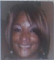 Woman smiling, light brown hair, indoors.