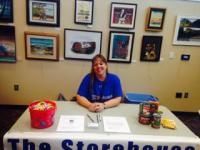 Woman smiling at table with 