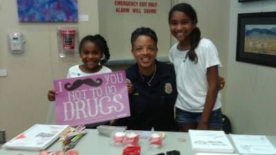 Woman with two girls holding a 