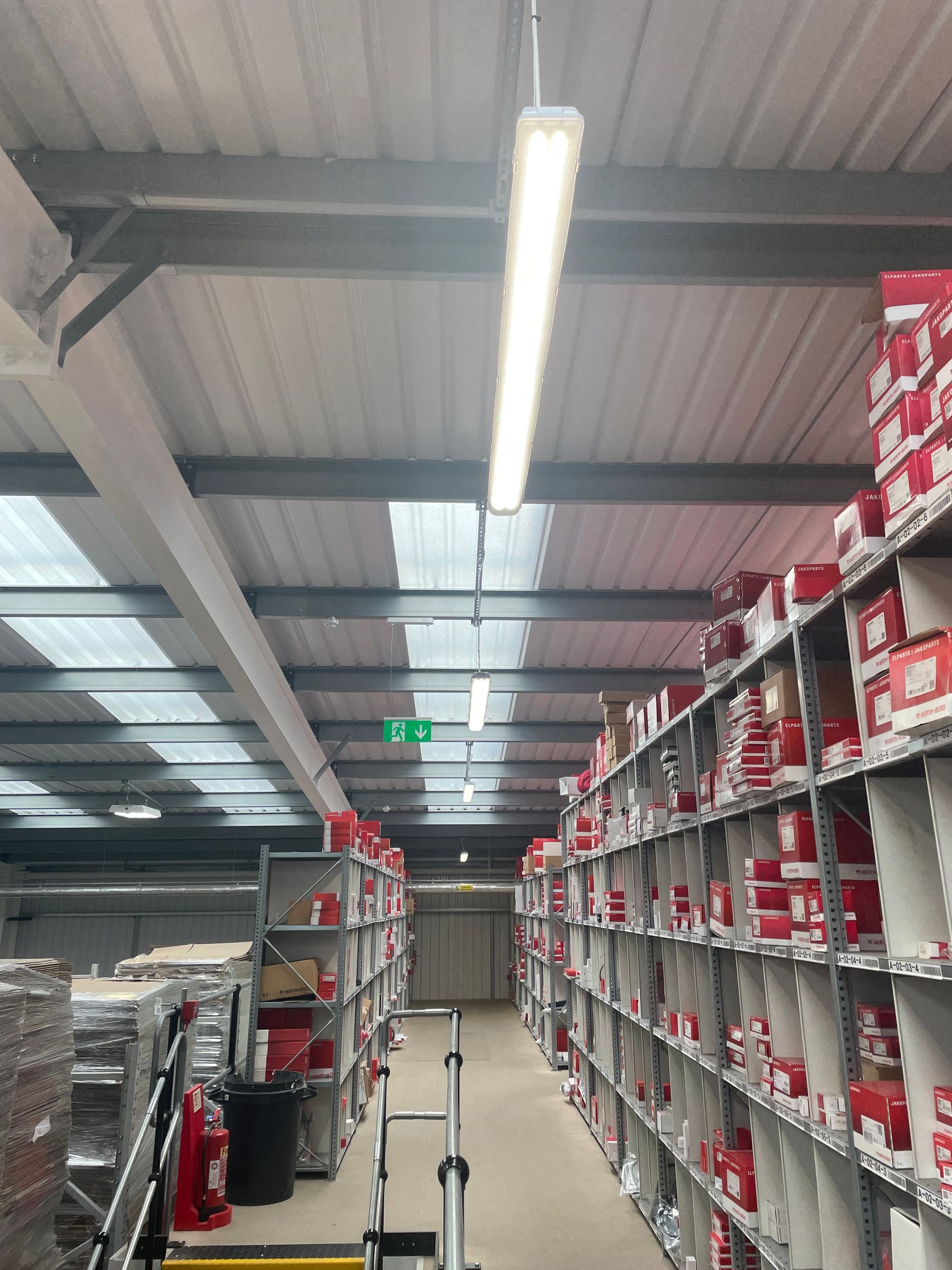 Suspended LED Lights in Warehouse Aisle