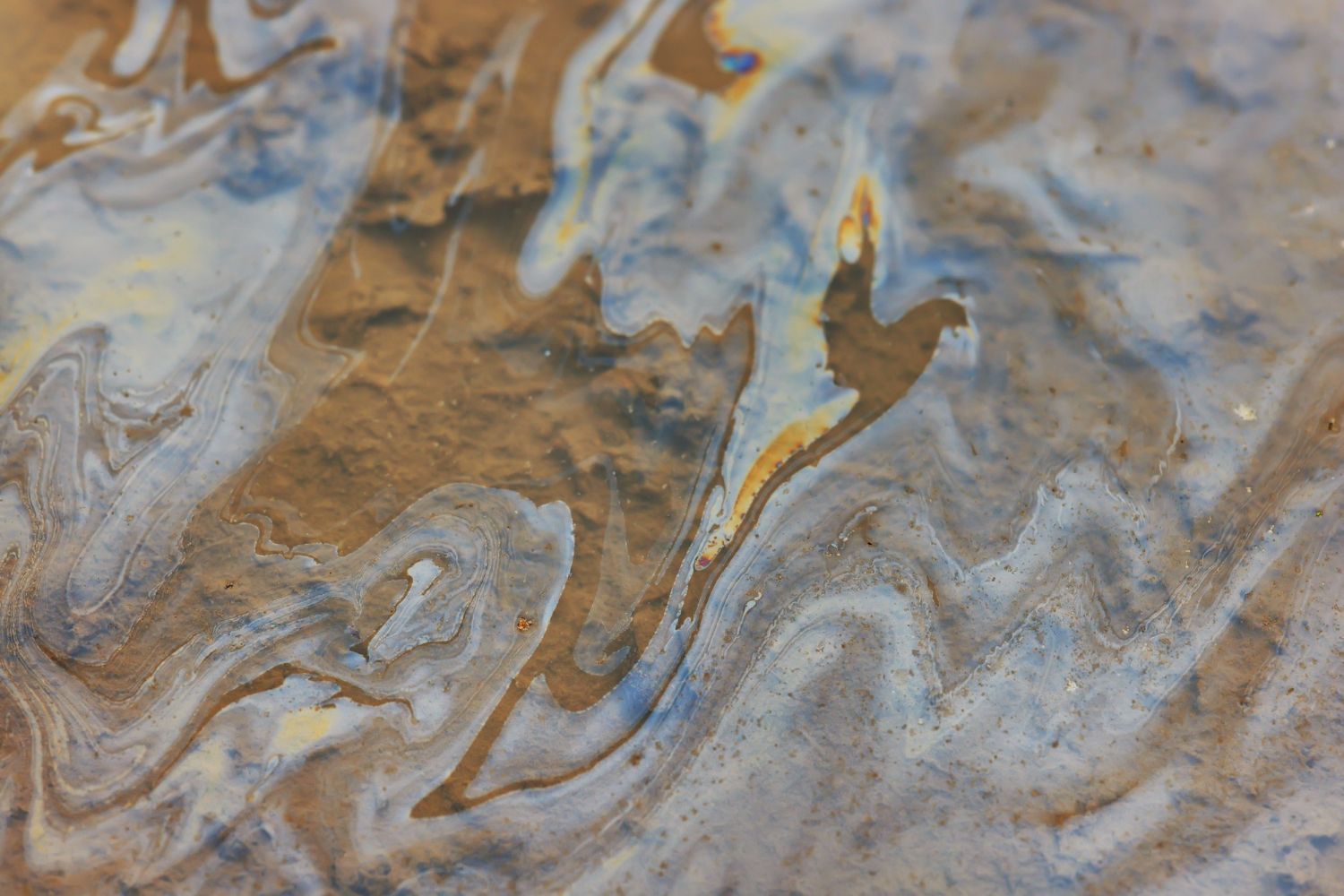 A close up of a marble texture with a swirl pattern.