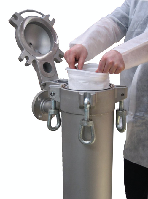 A person is putting a filter bag into a metal container