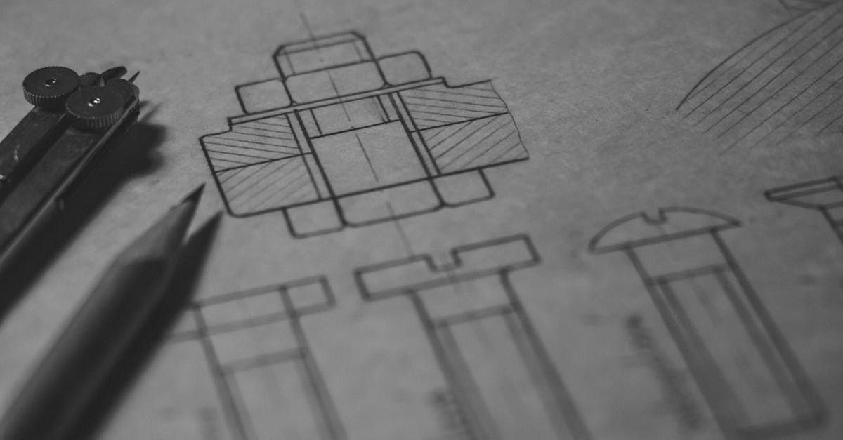 A black and white photo of a drawing of a box on a piece of paper.