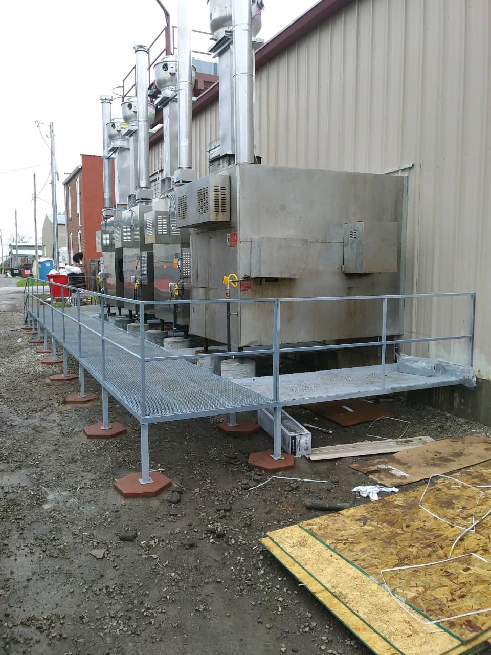 A metal walkway is being built in front of a building