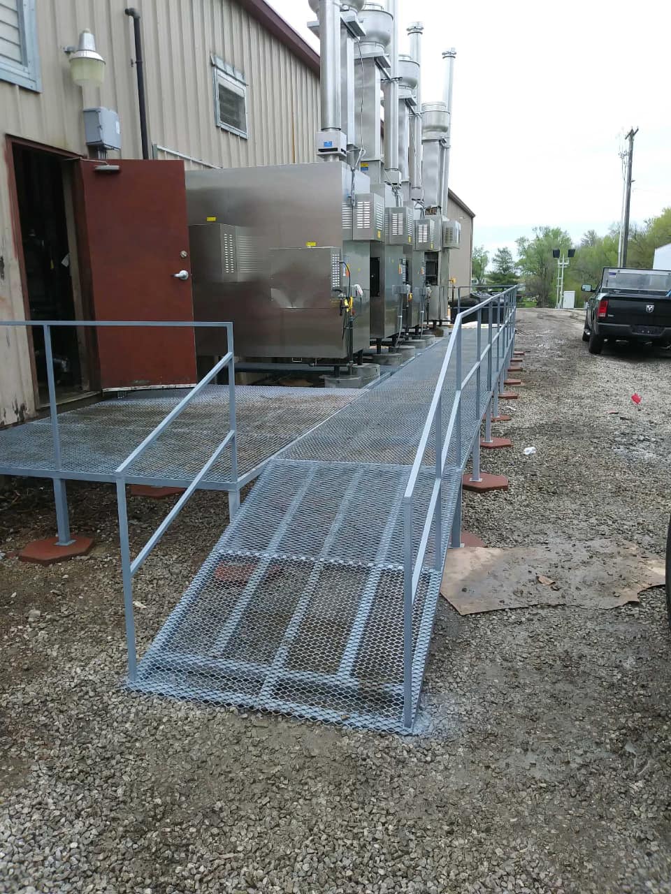 A metal ramp is being built in front of a building.