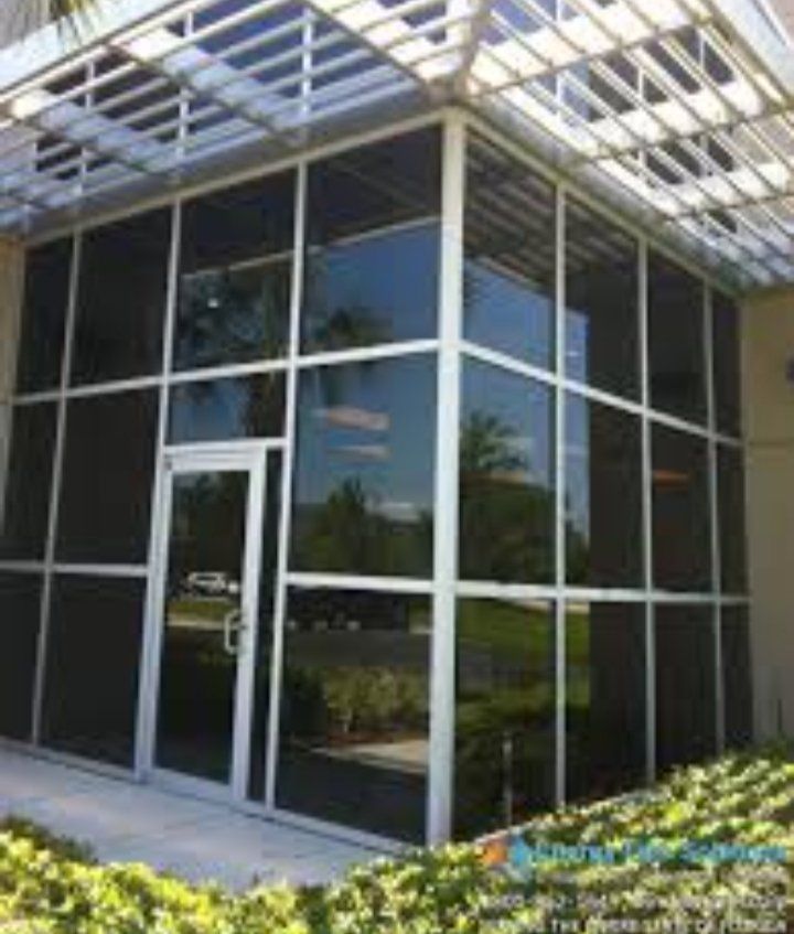 A building with a lot of windows and a door.