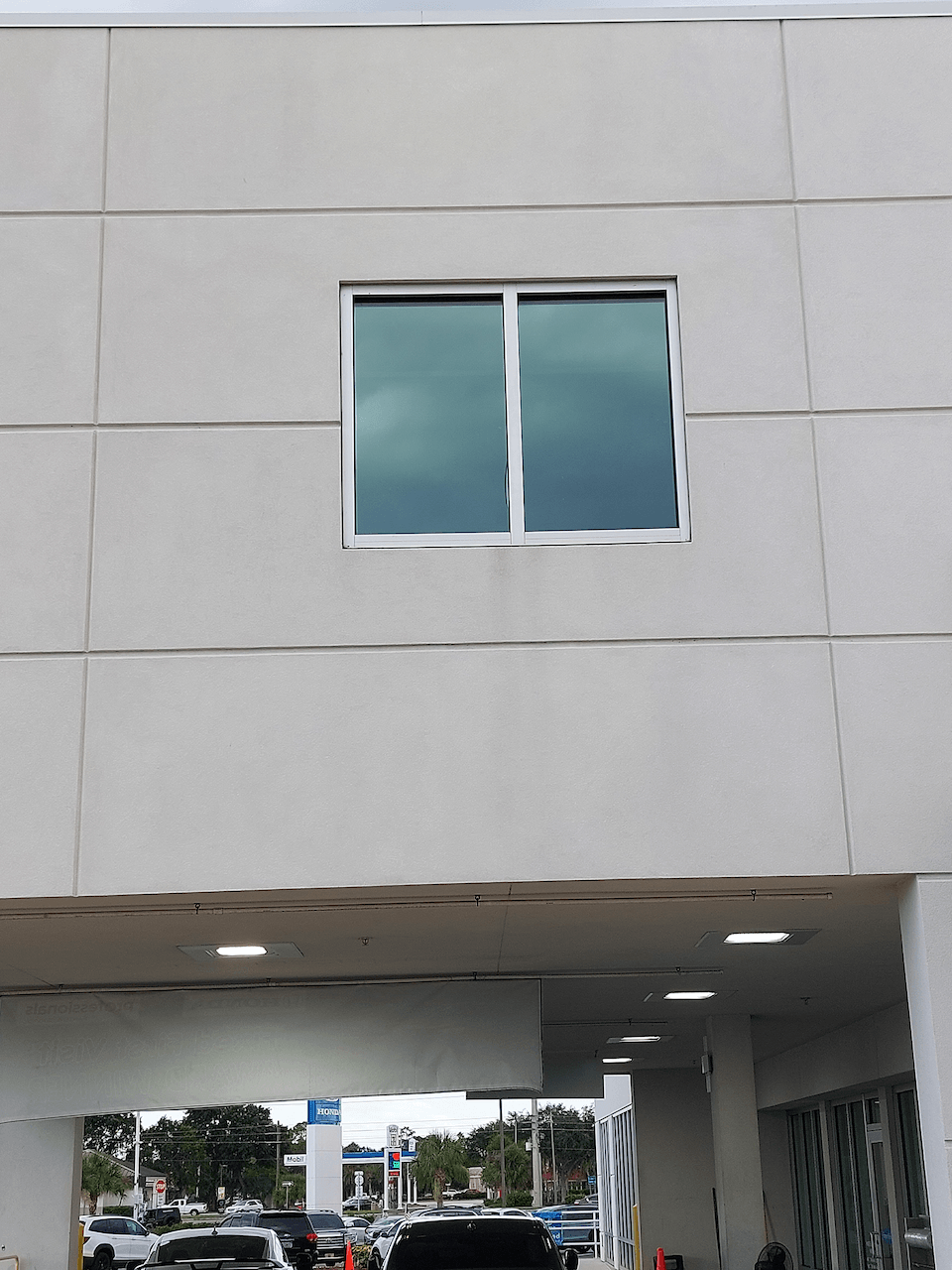 A building with a lot of cars parked in front of it