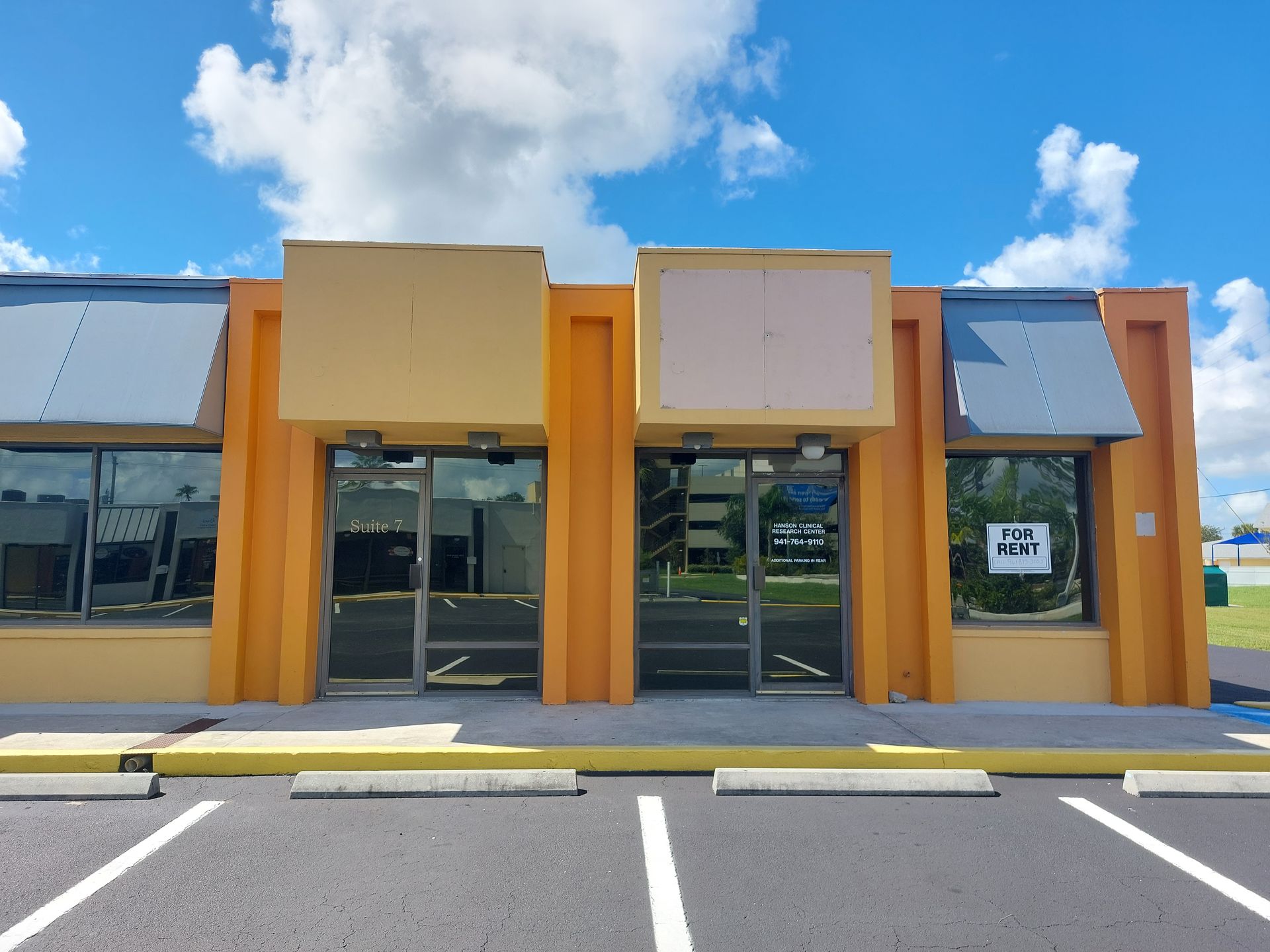 An orange building with a sign that says mr. on it