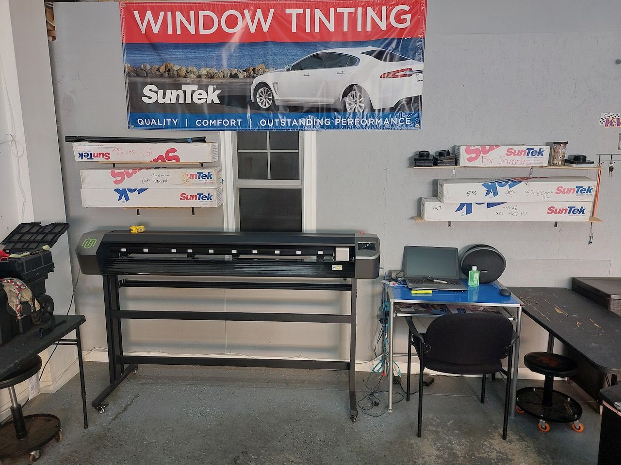 A room with a sign that says window tinting