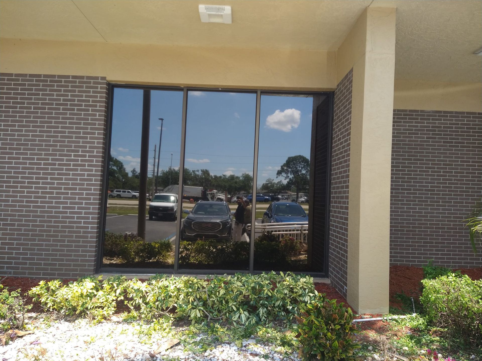 A brick building with cars parked in front of it