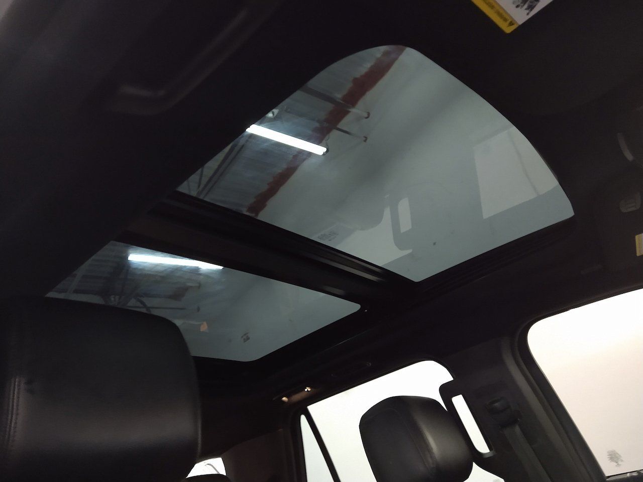 A car with a sunroof that is open