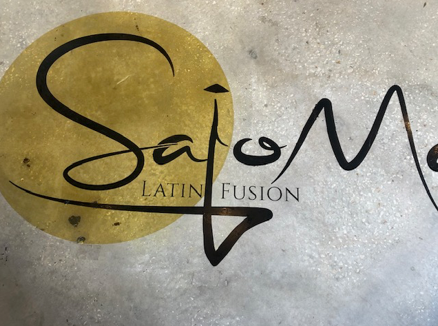 A sign that says latin fusion on it