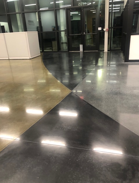 A shiny concrete floor with a geometric pattern in a building.