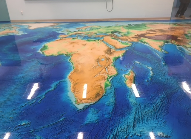 There is a map of the world on the floor.