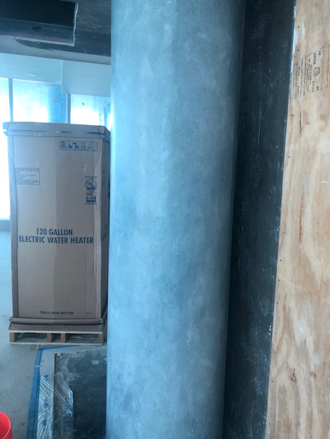 A cardboard box that says ' expansion electric water heater ' on it