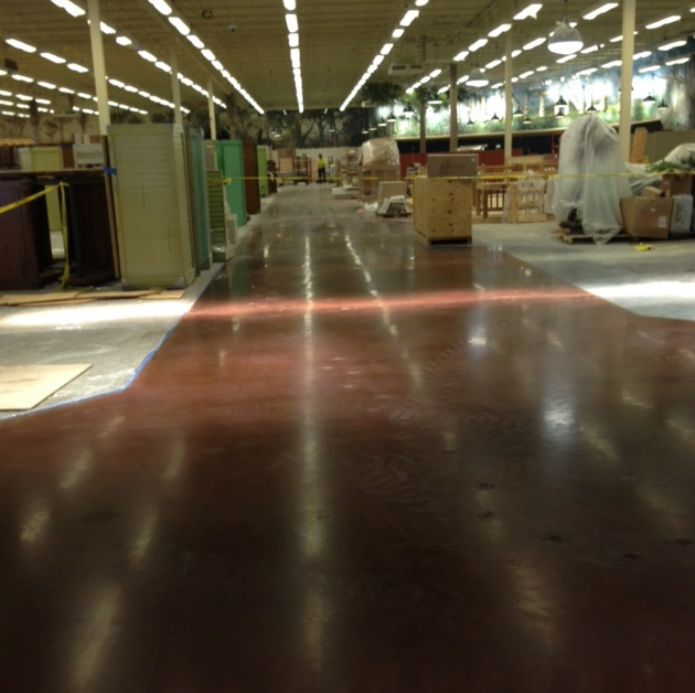 A warehouse with a lot of boxes on the floor